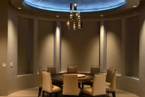 Contemporary Circular formal dining with elevated ceiling and indirect lighting